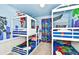 bedroom with two sets of bunk beds and Marvel theme at 3721 Pacific Ln, Davenport, FL 33897