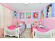 Princess themed bedroom with white beds and Disney princess wall art at 3721 Pacific Ln, Davenport, FL 33897
