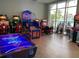Fun game room with air hockey and arcade games at 3721 Pacific Ln, Davenport, FL 33897