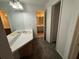 Double vanity bathroom with a large mirror and additional storage at 470 S Pin Oak Pl # 204, Longwood, FL 32779