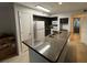 Kitchen with granite countertops and dark cabinets at 470 S Pin Oak Pl # 204, Longwood, FL 32779