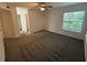 Bright bedroom with plush carpeting and ample closet space at 470 S Pin Oak Pl # 204, Longwood, FL 32779
