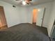 Bedroom with walk-in closet and neutral carpeting at 470 S Pin Oak Pl # 204, Longwood, FL 32779