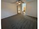 Spacious bedroom with neutral carpeting and access to bathroom at 470 S Pin Oak Pl # 204, Longwood, FL 32779