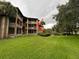 Exterior view of condo building showcasing screened balconies at 470 S Pin Oak Pl # 204, Longwood, FL 32779