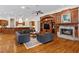 Elegant living room with hardwood floors, fireplace, and built-in entertainment center at 3499 Rockcliff Pl, Longwood, FL 32779