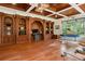 Home gym with built-in shelving, hardwood floors, and a view of the backyard at 3499 Rockcliff Pl, Longwood, FL 32779