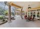 Covered patio with outdoor dining and seating areas at 3499 Rockcliff Pl, Longwood, FL 32779