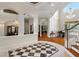 Elegant entryway with a checkerboard floor, high ceilings, and views into the dining and living areas at 3499 Rockcliff Pl, Longwood, FL 32779