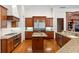 Large kitchen with island, stainless steel appliances, and granite countertops at 3499 Rockcliff Pl, Longwood, FL 32779