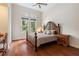Spacious bedroom with hardwood floors and a large, ornate bed at 3499 Rockcliff Pl, Longwood, FL 32779