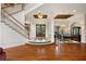 Elegant entryway with hardwood floors, grand staircase, and formal dining room at 3499 Rockcliff Pl, Longwood, FL 32779