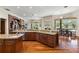 Large kitchen with granite island, stainless steel appliances, and hardwood floors at 3499 Rockcliff Pl, Longwood, FL 32779