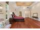 Main bedroom with hardwood floors, king-size bed, and sitting area at 3499 Rockcliff Pl, Longwood, FL 32779