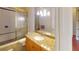 Well-lit bathroom with granite countertop, shower and toilet at 3499 Rockcliff Pl, Longwood, FL 32779