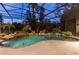 Relaxing freeform pool with screened enclosure at 3499 Rockcliff Pl, Longwood, FL 32779