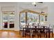 Elegant dining room with hardwood floors and views of the pool and patio at 3499 Rockcliff Pl, Longwood, FL 32779
