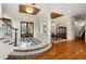 Grand entryway with a checkered floor, hardwood floors, and a view into the dining room at 3499 Rockcliff Pl, Longwood, FL 32779