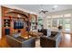 Living room with hardwood floors, built-in entertainment center, and fireplace at 3499 Rockcliff Pl, Longwood, FL 32779