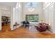 Spacious living room with hardwood floors, high ceilings, and access to the pool at 3499 Rockcliff Pl, Longwood, FL 32779