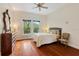 Spacious bedroom with hardwood floors and plenty of natural light at 3499 Rockcliff Pl, Longwood, FL 32779