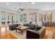 Open living space with hardwood floors, access to pool area, and a view of the backyard at 3499 Rockcliff Pl, Longwood, FL 32779