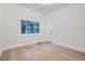 Well-lit bedroom featuring hardwood floors and a window at 734 S Mills Ave, Orlando, FL 32801
