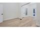 Light-filled bedroom featuring hardwood floors and French doors at 734 S Mills Ave, Orlando, FL 32801