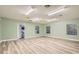Bright office space with wood flooring, multiple windows and an exterior door at 734 S Mills Ave, Orlando, FL 32801