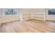 Bright bedroom with hardwood floors, built-in shelving, and large windows at 734 S Mills Ave, Orlando, FL 32801