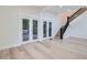 Living area with hardwood floors, French doors, and a staircase at 734 S Mills Ave, Orlando, FL 32801