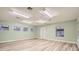 Bright office space featuring wood flooring, multiple windows and an exterior door at 734 S Mills Ave, Orlando, FL 32801