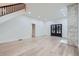 Bright living area with hardwood floors, a fireplace, and access to other rooms at 734 S Mills Ave, Orlando, FL 32801