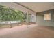 Spacious back porch overlooking a private backyard with mature trees at 734 S Mills Ave, Orlando, FL 32801