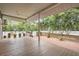 Large back porch with wood deck, planters and lush green backyard view at 734 S Mills Ave, Orlando, FL 32801
