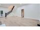 Open living space with hardwood floors and a staircase at 734 S Mills Ave, Orlando, FL 32801