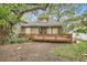 View of house from backyard, highlighting deck and landscaping at 734 S Mills Ave, Orlando, FL 32801