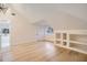 Bright bedroom with hardwood floors, built-in shelving, and vaulted ceiling at 734 S Mills Ave, Orlando, FL 32801