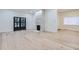 Light-filled living room features hardwood floors, a stone fireplace, and French doors at 734 S Mills Ave, Orlando, FL 32801