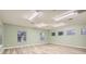 Spacious office with light green walls, wood flooring and multiple windows at 734 S Mills Ave, Orlando, FL 32801