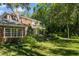 Landscaped backyard with lush greenery and spacious lawn at 1391 Richmond Rd, Winter Park, FL 32789