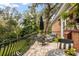Brick patio with comfortable seating and views of the garden at 1391 Richmond Rd, Winter Park, FL 32789