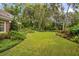 Expansive backyard with manicured lawn and lush landscaping at 1391 Richmond Rd, Winter Park, FL 32789