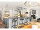 Kitchen features a breakfast bar with seating and views into the Gathering room at 1391 Richmond Rd, Winter Park, FL 32789
