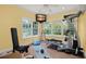 Bright home gym with various exercise equipment and large windows at 1391 Richmond Rd, Winter Park, FL 32789