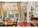 Bright dining room with large windows, hardwood floors, and a statement chandelier at 1391 Richmond Rd, Winter Park, FL 32789