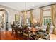 Elegant dining room featuring a large table, chandelier, and decorative wall accents at 1391 Richmond Rd, Winter Park, FL 32789