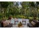 Relaxing patio oasis with lush landscaping and comfortable seating at 1391 Richmond Rd, Winter Park, FL 32789