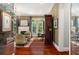 Elegant living room with hardwood floors, fireplace, and access to a private patio at 1391 Richmond Rd, Winter Park, FL 32789