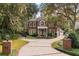 Grand two-story brick home with a circular driveway at 1391 Richmond Rd, Winter Park, FL 32789